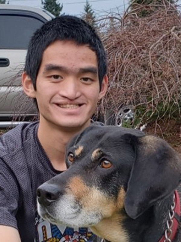 headshot of fen truitt 2022 holt camp counselor with dog