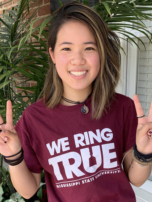 headshot of shali holt camp counselor wearing college shirt