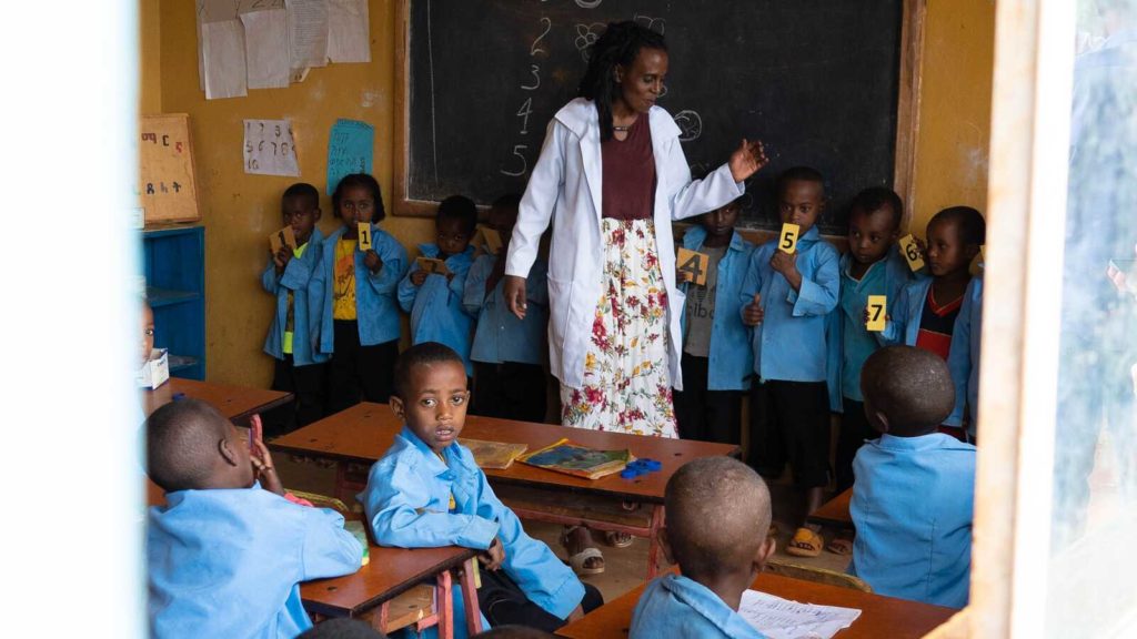 A teacher and students in a classroom at Wallana ECCD center in Ethiopia.