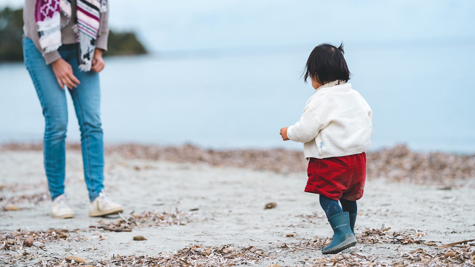 photo of baby walking to mother to show adoption fundraising ideas