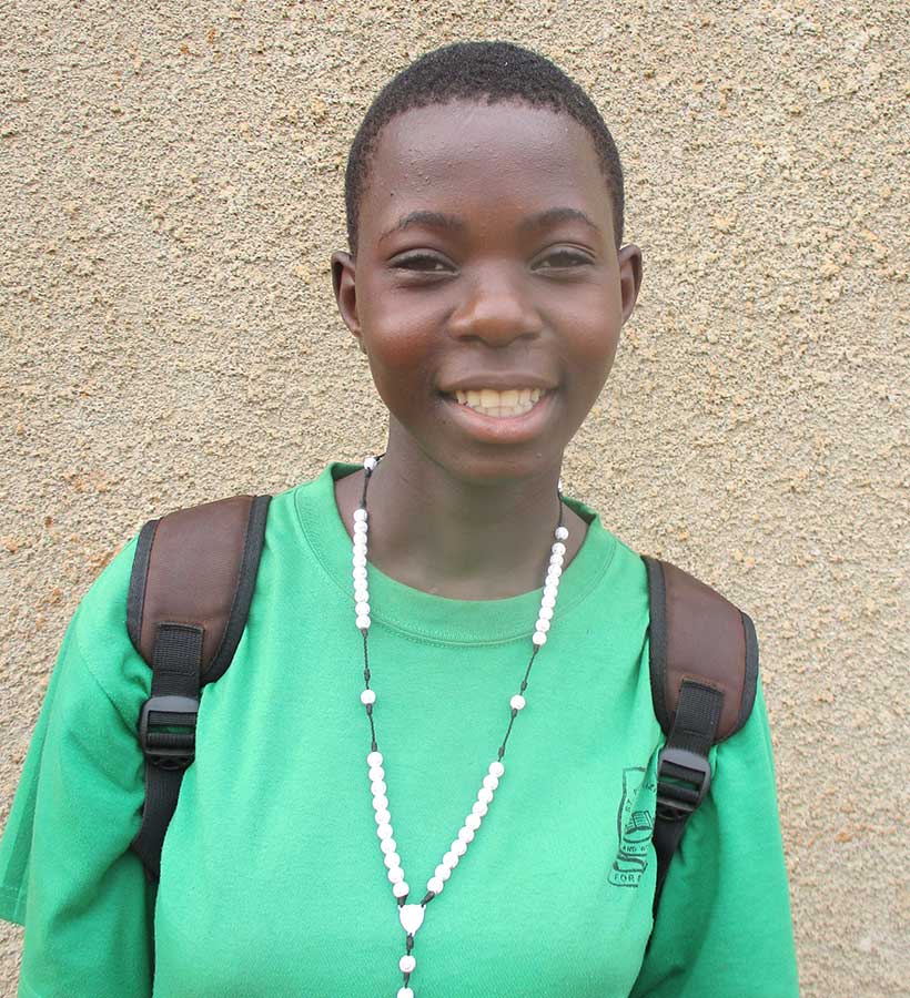 Sponsored child in Uganda, 14-year-old Gloria, in a backpack for school.