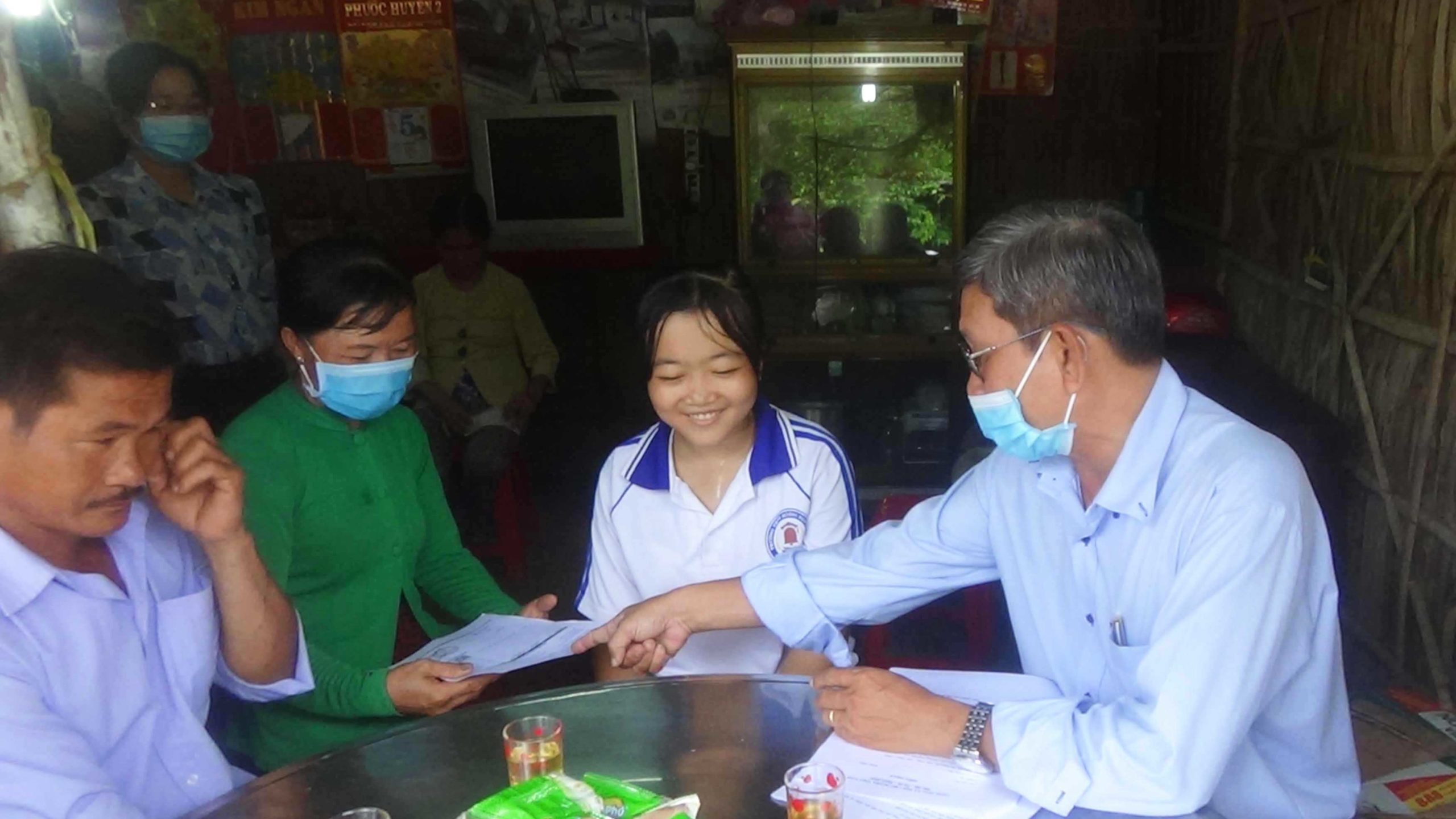 Sponsored child Tran receiving a generous gift from her sponsors in Vietnam
