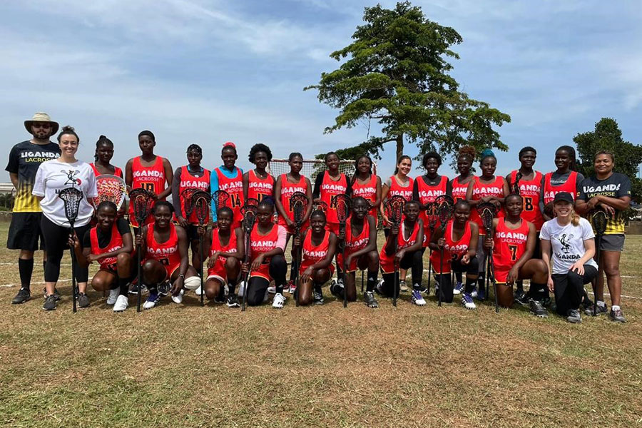 Uganda Women's National Lacrosse Team 2022 and Thuy Williams posed for a group picture, adoptee achievements