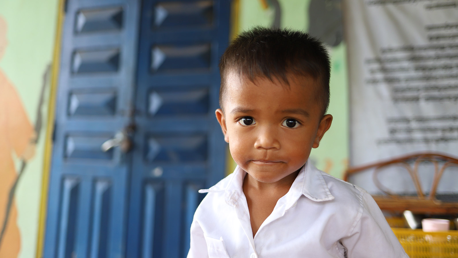 little boy in cambodia looking at the camera
