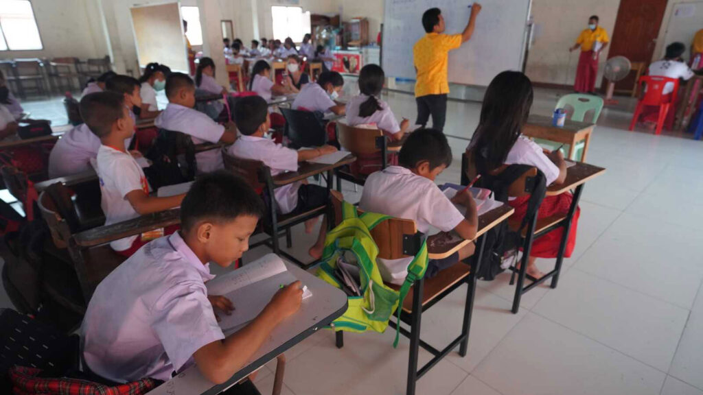 Burmese migrant students at desks in Thailand