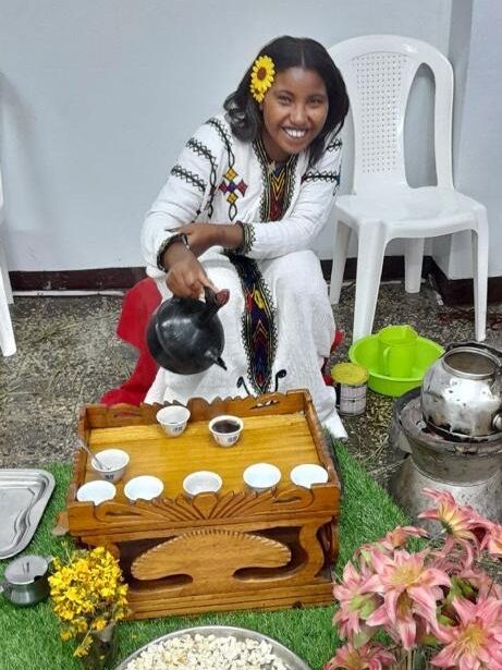 woman celebrating the new year in Ethiopia pouring tea