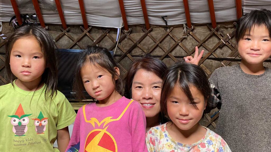 Holt vice president Thoa Bui with sponsored children in Mongolia.