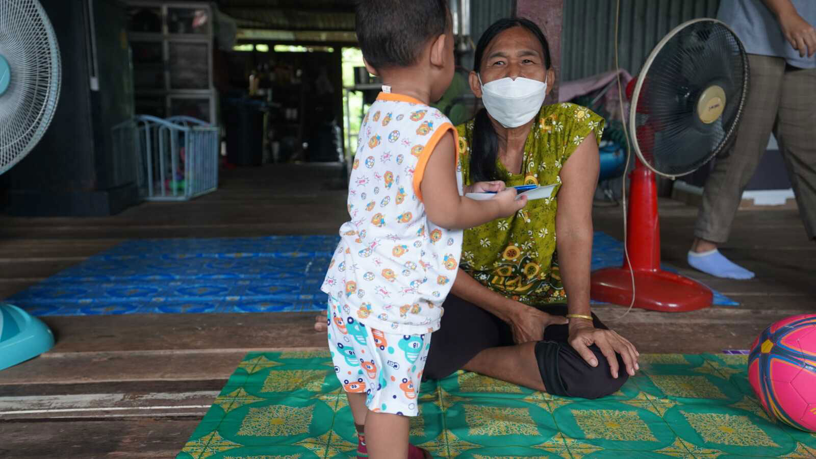 Boy with his foster mom in Thailand
