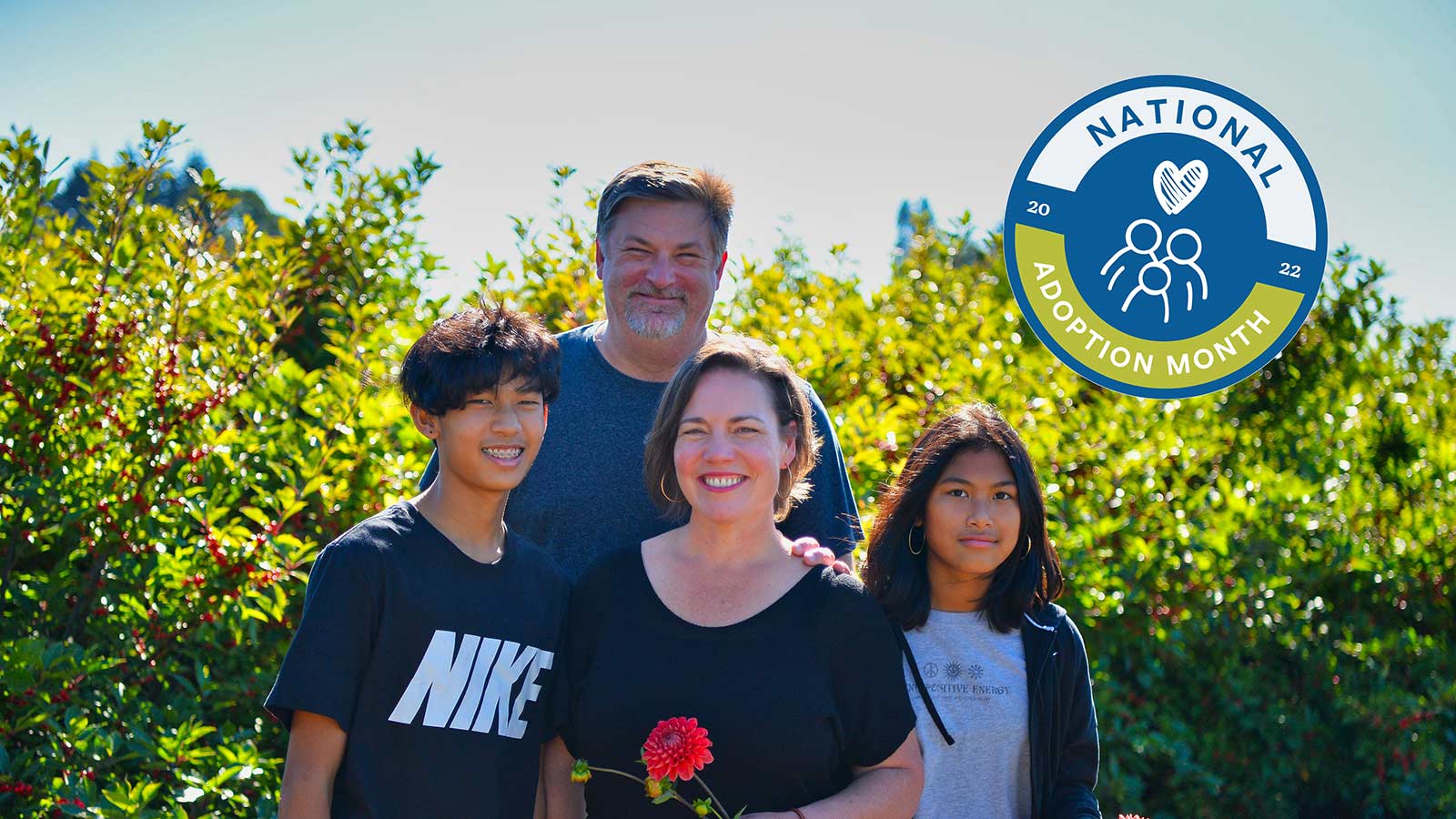 Susie Doig and family with National Adoption Month badge