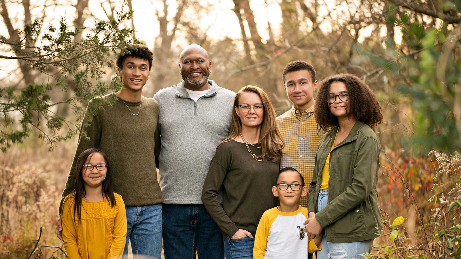 Adoptive family in autumn colors outside