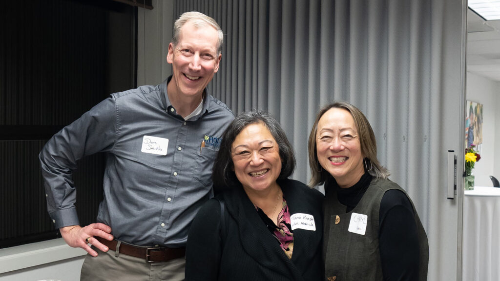 Holt's interim CEO Dan Smith with adult adoptees at Holt's adoptee gathering in November 2022