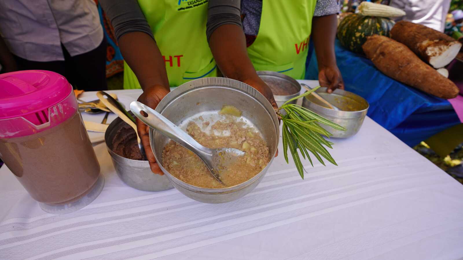 a woman holds a bowl of porridge