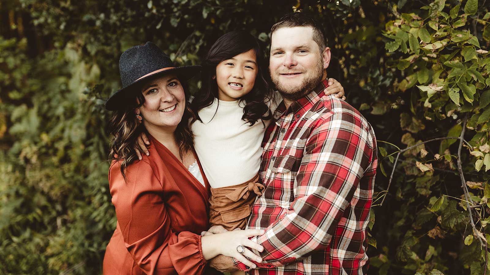 Burmeister family photo outdoors adoption agency review of Holt after adopting daughter from China