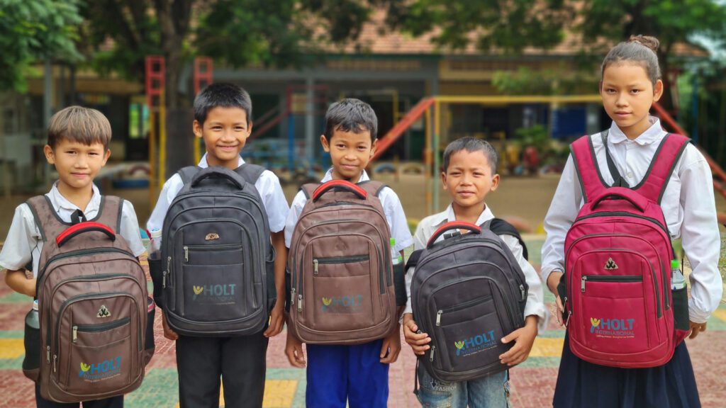 Kids with backpacks in Cambodia