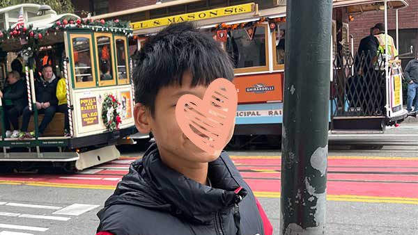 Young boy on busy street