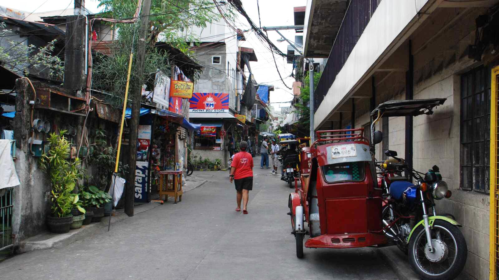 A woman walks down the street in Metro Manila, Philippines.