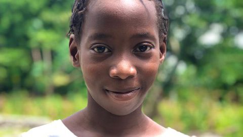 Little girl smiles at camera