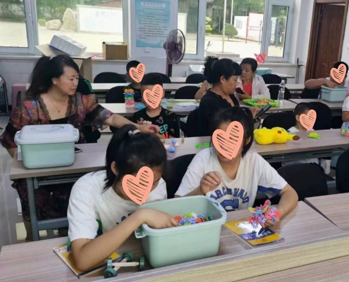 Group of children in classroom play with games and activities