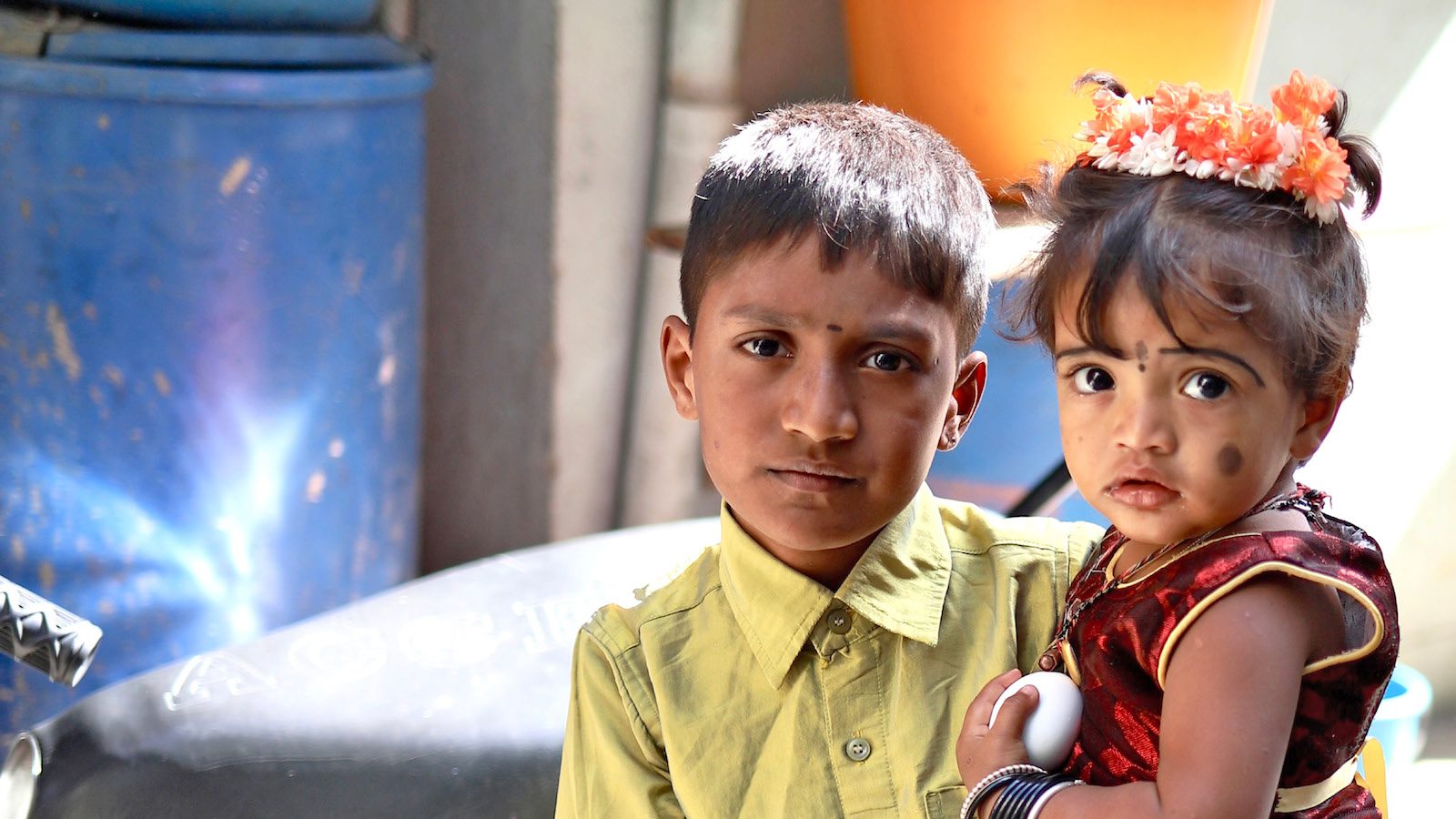 Siblings looking intently at the camera