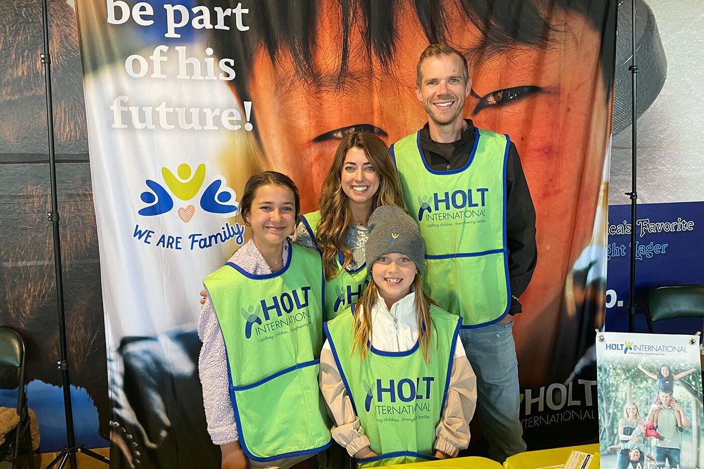 A family volunteering at a concert