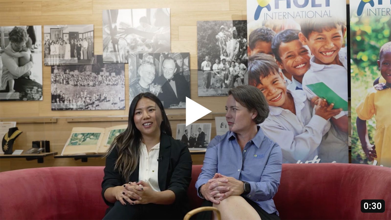 Adoptee Katelyn Marks and Holt senior executive Susie Doig on the red couch at Holt