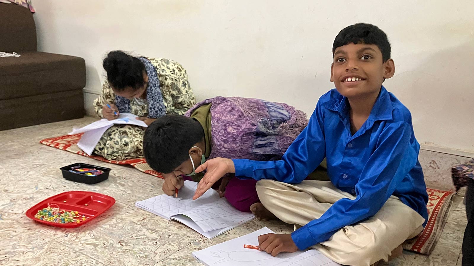 Children with disabilities reading and writing in India