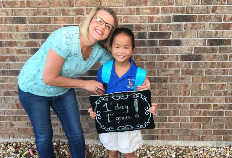 First day of kindergarten, Koni poses with her daugher Jing, who was adopted from China