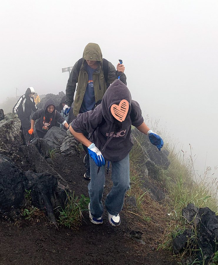 An HIV orphan in China who lives at Holt-supported group home hikes with her friends.